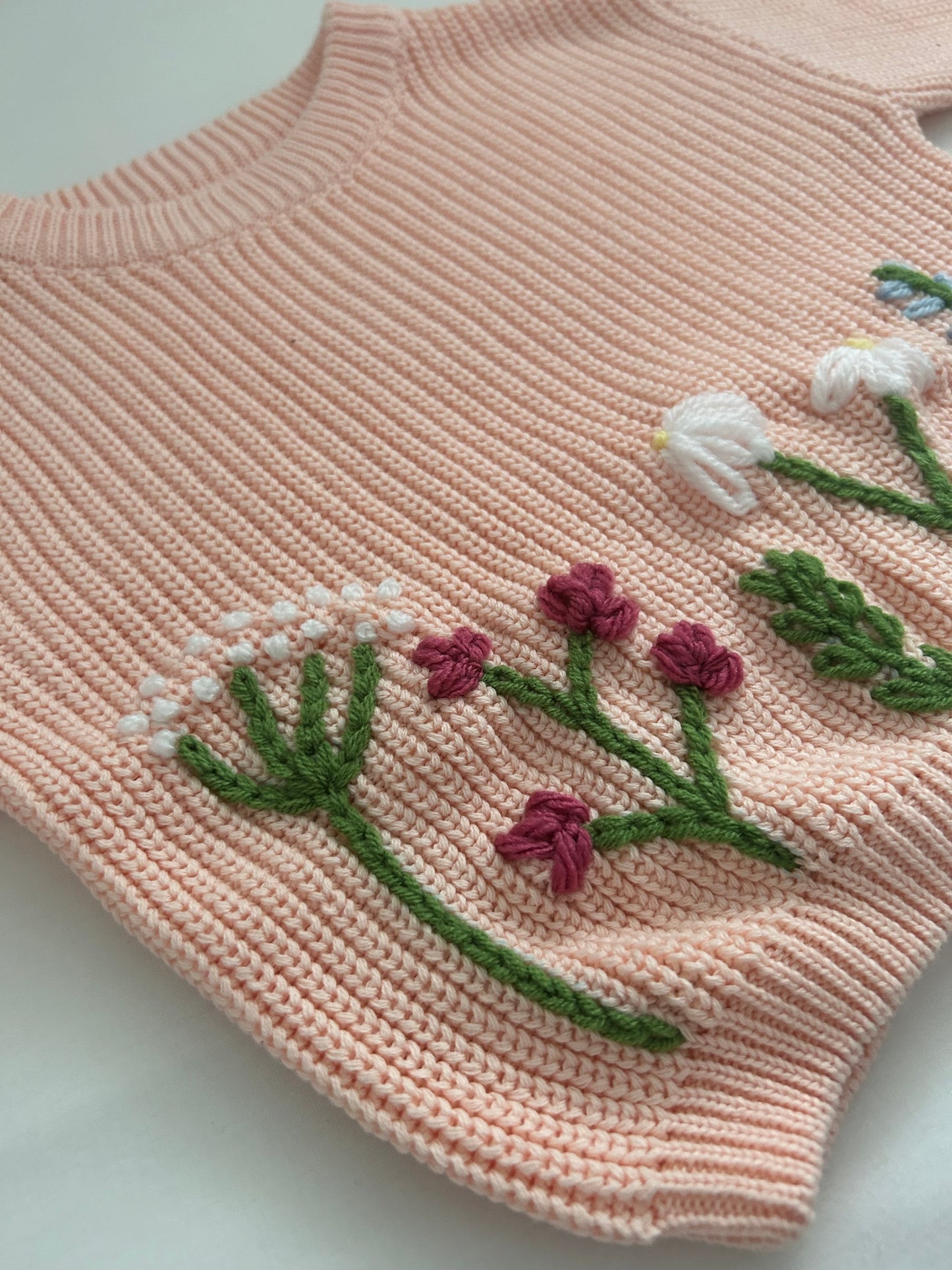 Peach embroidered baby’s jumper