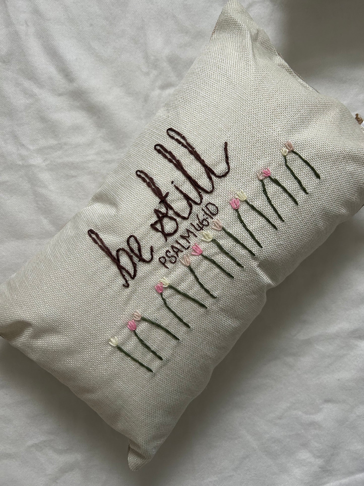 ‘Be still’ embroidered cushion
