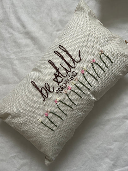 ‘Be still’ embroidered cushion