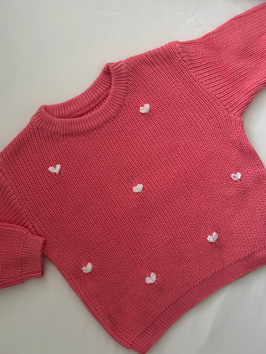 Bright pink embroidered baby’s jumper